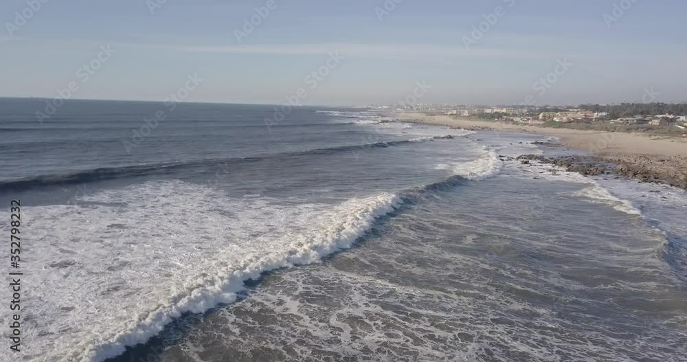 Aerial fly-by shot of the ocean at Madalena beach. Aerial fly-by shot of the ocean at Madalena beach.