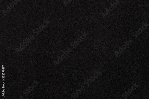 Black cloth texture background. Close-up.