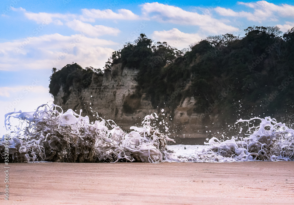 Sand Rushing Foam monsters created by a rushing tide breaching the sand at Hebara ...