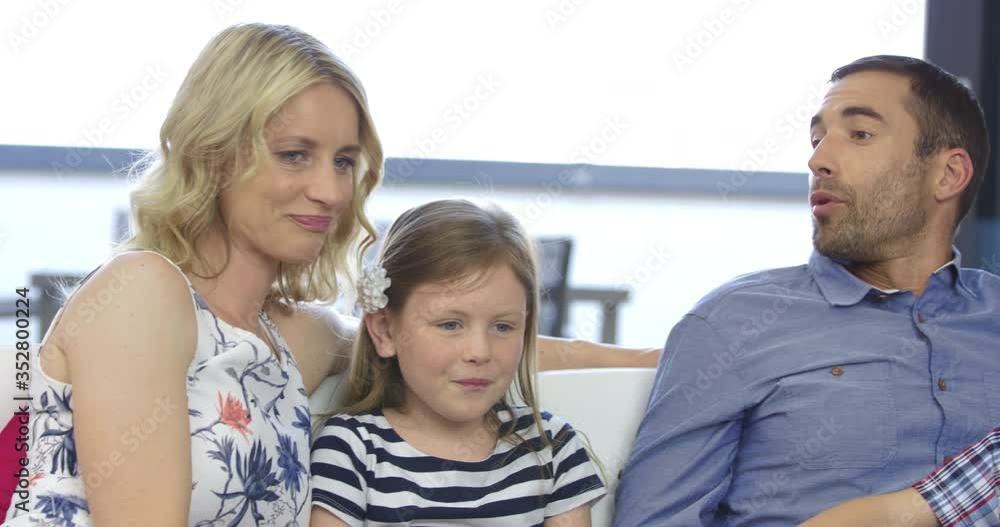 4K Of Family Spending Their Free Time By Chatting And Watching Television 4K Of Family Spending Their Free Time By Chatting And Watching Television