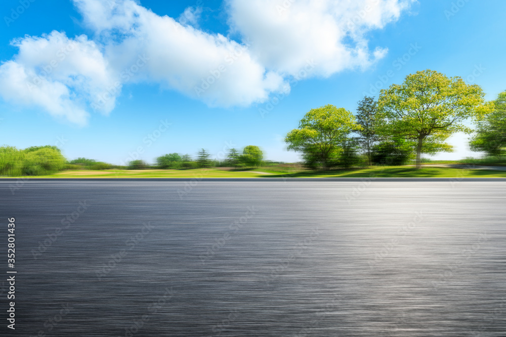 Fast moving asphalt road and green forest landscape. Fast moving asphalt road and green forest landscape.