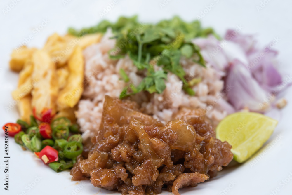 Caramelized pork and rice mixed with shrimp paste isolated on white background. Caramelized pork and rice mixed with shrimp paste isolated on white background.