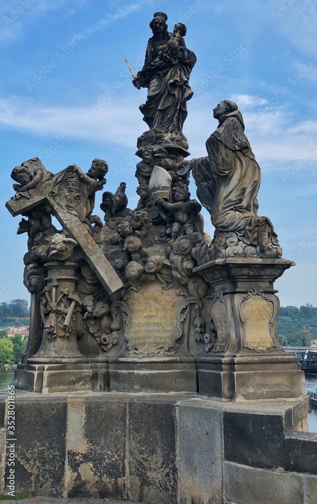 Ancient statue at Charle's Bridge Prague Czechia
