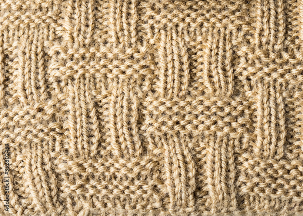 Knitted background. Knitted texture. A sample of knitting from wool. Knitting Pattern. Knitted background. Knitted texture. A sample of knitting from wool. Knitting Pattern.