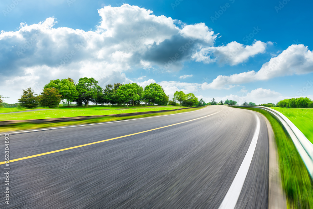 Fast moving asphalt road and green forest landscape. Fast moving asphalt road and green forest landscape.