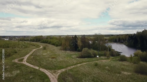 Aerial: May country landscape with lake views. New Moscow area near Kamenka village, Russia.
Color graded. photo