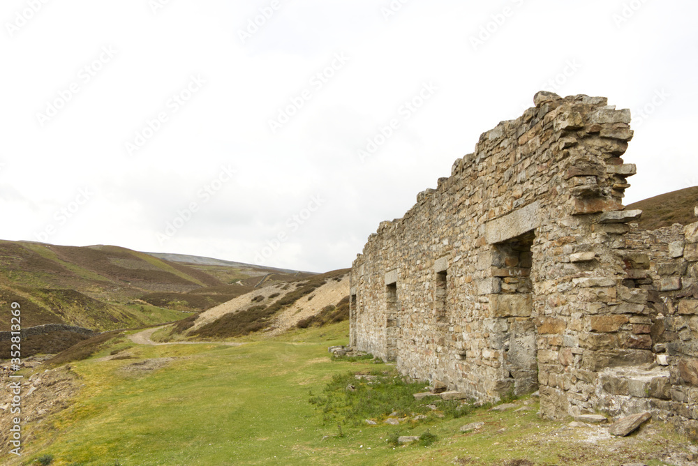 lead mine ruins  in the Yorkshire Dales, U.K. with storm sky in the back ground