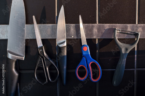 Kitchenware and scissors on the magnetic line