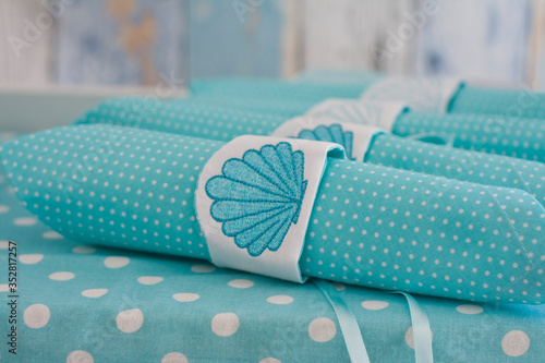 Aqua napkins with embroidered napkin rings