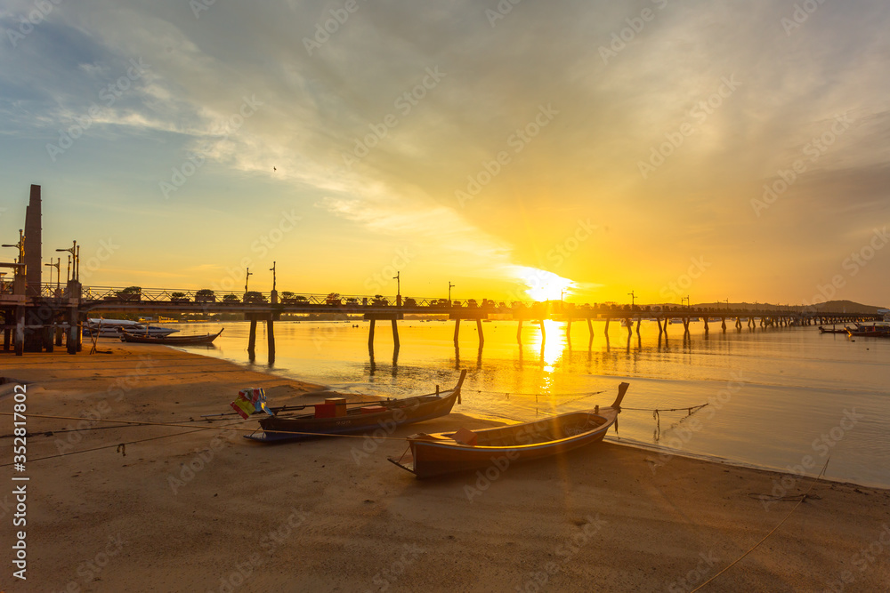 Obraz premium sunrise at Chalong pier. Chalong bay is the most important marina of Phuket there have 2 piers and customs at pier..