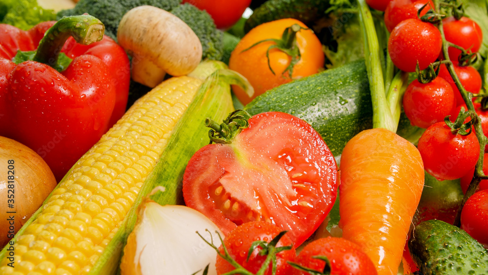 Closeup abstract image of fresh cut vegetables on kitchen table Background for healthy food and GMO free products.Diet nutrition and fresh vegetables. Vegan and vegetarian background. Closeup abstract image of fresh cut vegetables on kitchen table Background for healthy food and GMO free products.Diet nutrition and fresh vegetables. Vegan and vegetarian background.