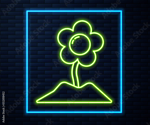 Glowing neon line Flower icon isolated on brick wall background. Vector Illustration