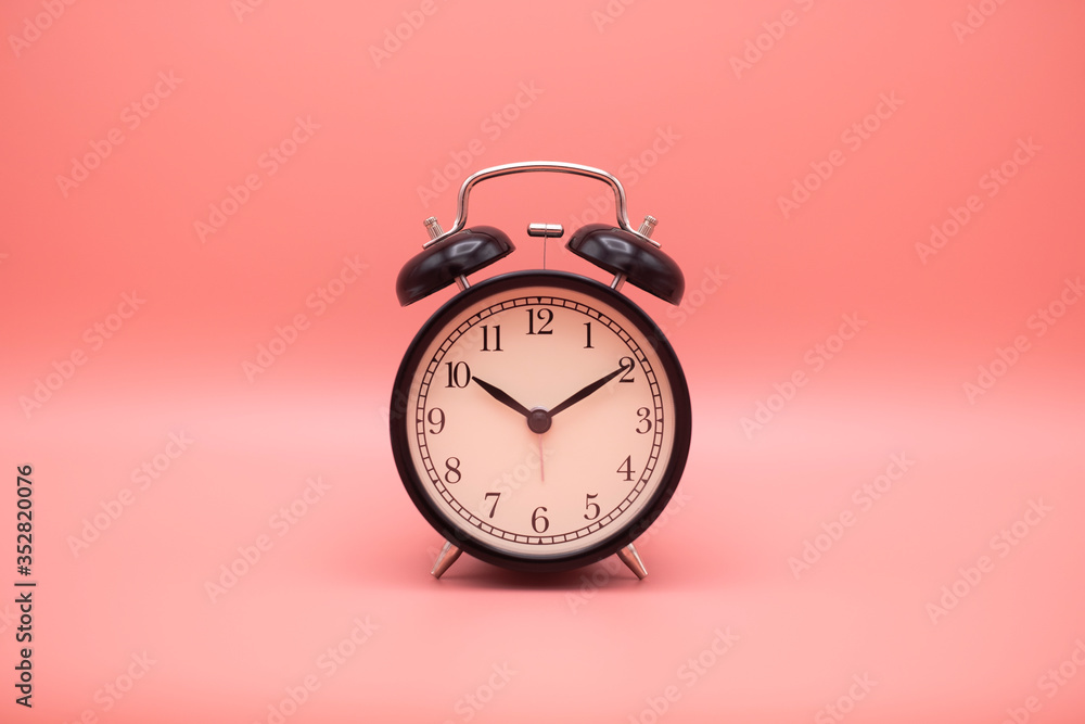 Alarm clock on pink background with copy space for you design. Alarm clock on pink background with copy space for you design.