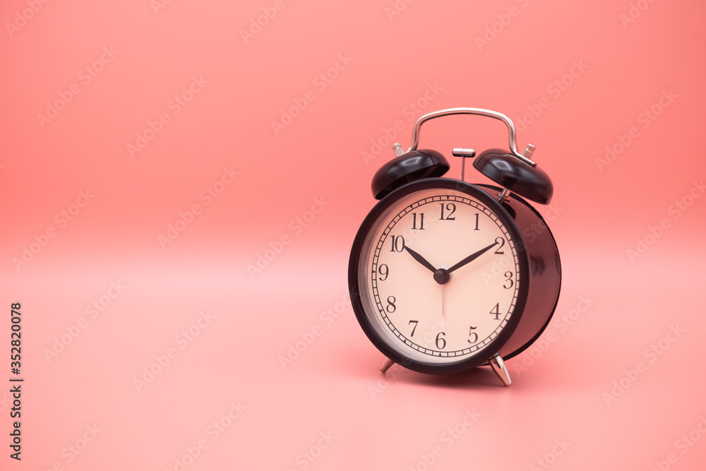 Alarm clock on pink background with copy space for you design. Alarm clock on pink background with copy space for you design.