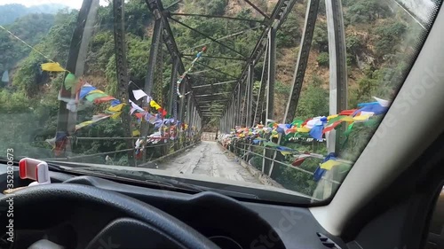 Bridge with prayer flags, Mangan, Sikkim, India photo