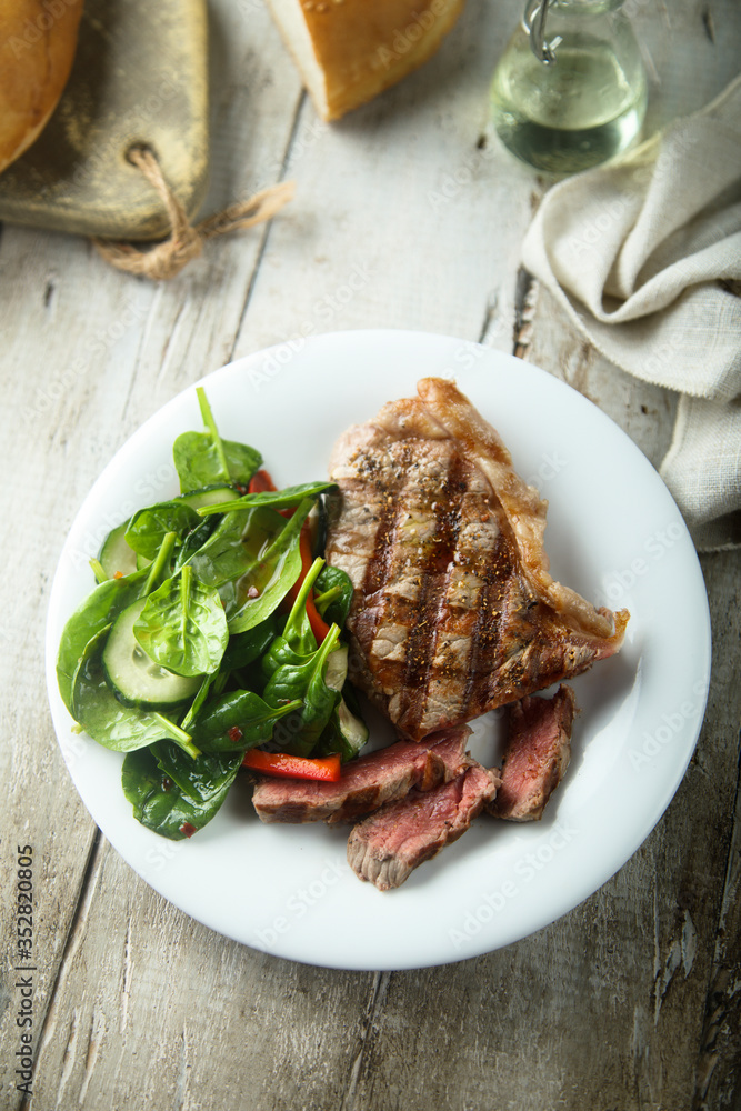 Grilled beef steak with salad