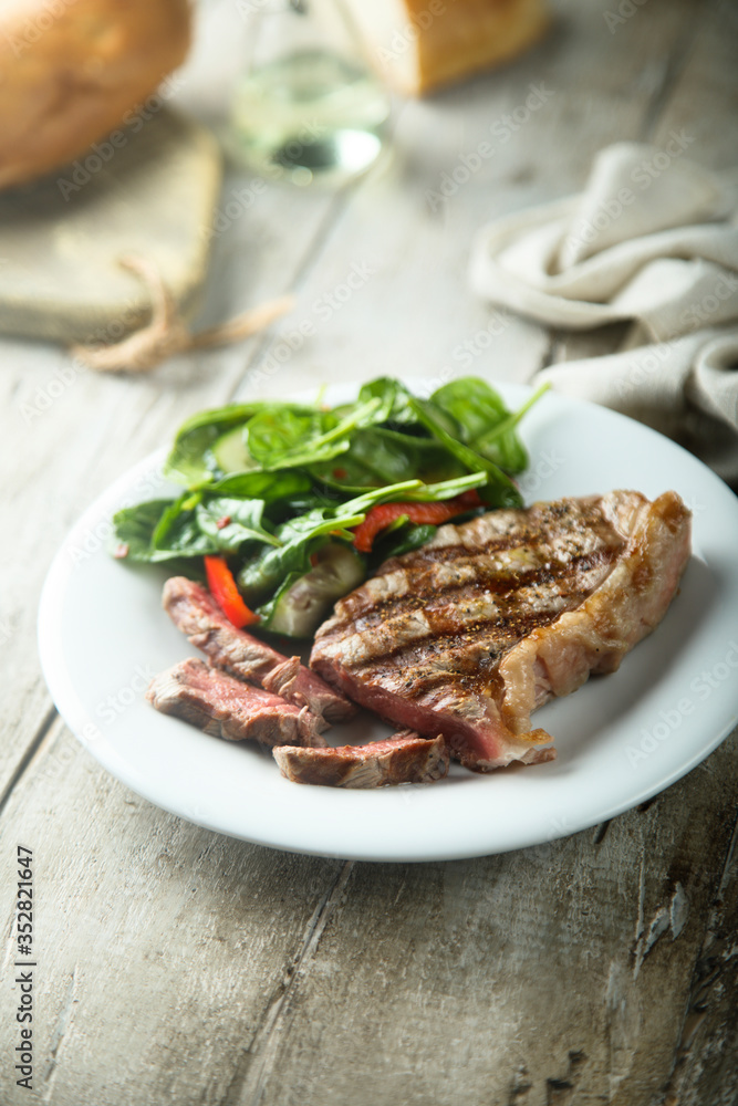 Grilled beef steak with salad
