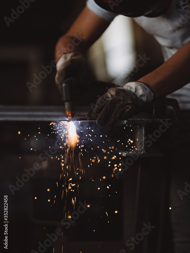 Professional welder at work in his factory