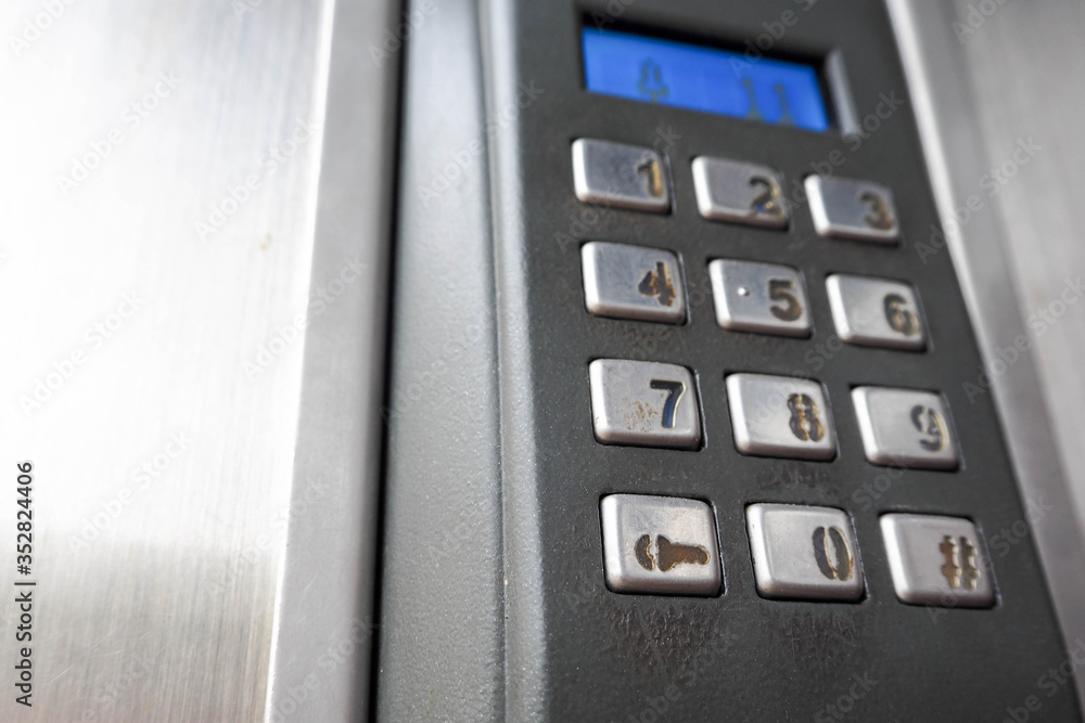 metal gray intercom with numbers and the number eleven dialed on the screen visit to the apartment. the bell metal gray intercom with numbers and the number eleven dialed on the screen visit to the apartment. the bell