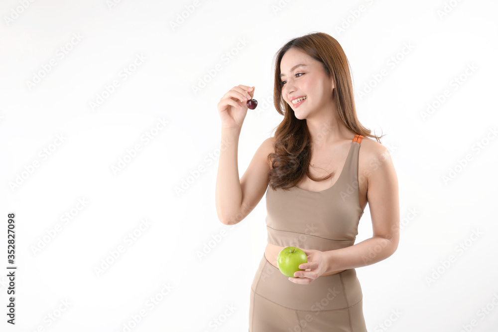Beautiful Asian healthy girl with Cherry and apple isolated on white background. Beautiful Asian healthy girl with Cherry and apple isolated on white background.