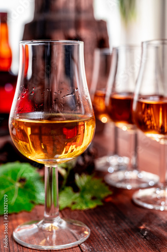 Tasting of aged french cognac brandy in old cellars of cognac-producing regions Champagne or Bois, France