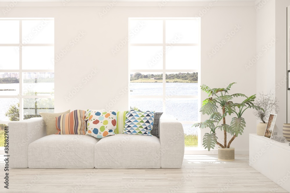 Fototapeta premium White living room with sofa and summer landscape in window. Scandinavian interior design. 3D illustration