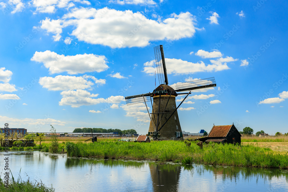 Old windmills on dutch landscape, Kinderdijk is a village in the municipality of Molenlanden, in the province of South Holland, Netherlands