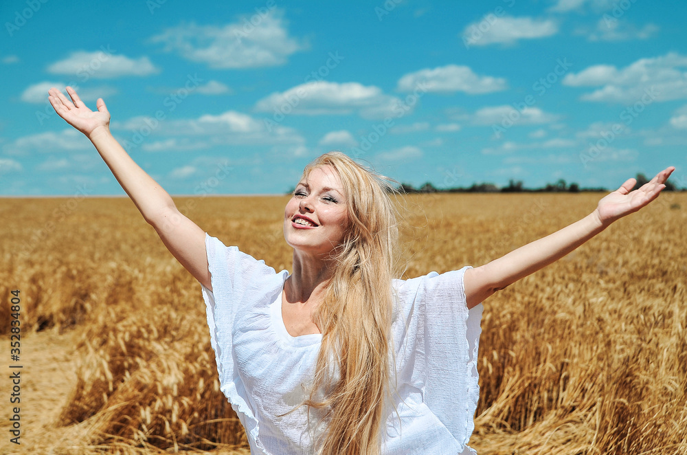 Woman posing in field with wheats. Woman posing in field with wheats.