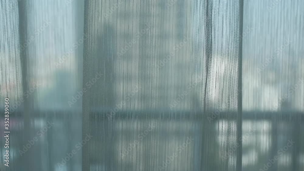 sheer curtain (translucent fabric) and balcony with city view from high rise building, lonely feeling after staying home all day or all week, living alone in self-isolation, shallow depth of field sheer curtain (translucent fabric) and balcony with city view from high rise building, lonely feeling after staying home all day or all week, living alone in self-isolation, shallow depth of field