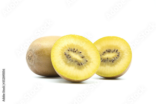 Whole and cut in half image of golden kiwi fruit isolated on white background