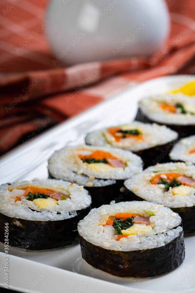 a plate of freshly made kimbap a plate of freshly made kimbap