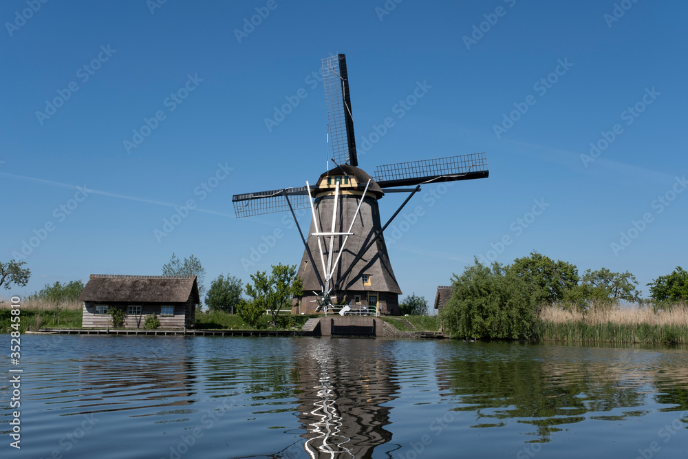 Netherlands rural lanscape with windmills at famous tourist site Kinderdijk in Holland