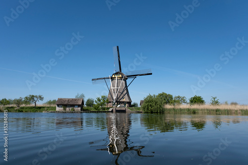 beautiful windmill landscape at kinderdijk in the netherlands © Tjeerd