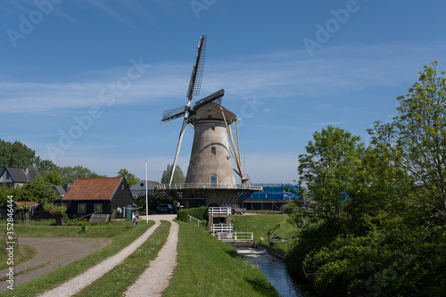 Traditional setting of the historical dutch windmills landscape at the Netherlands, an UNESCO world heritage site