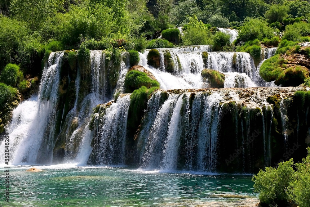 Beautiful waterfalls in National Park Krka, Croatia on a sunny summer day. Beautiful waterfalls in National Park Krka, Croatia on a sunny summer day.