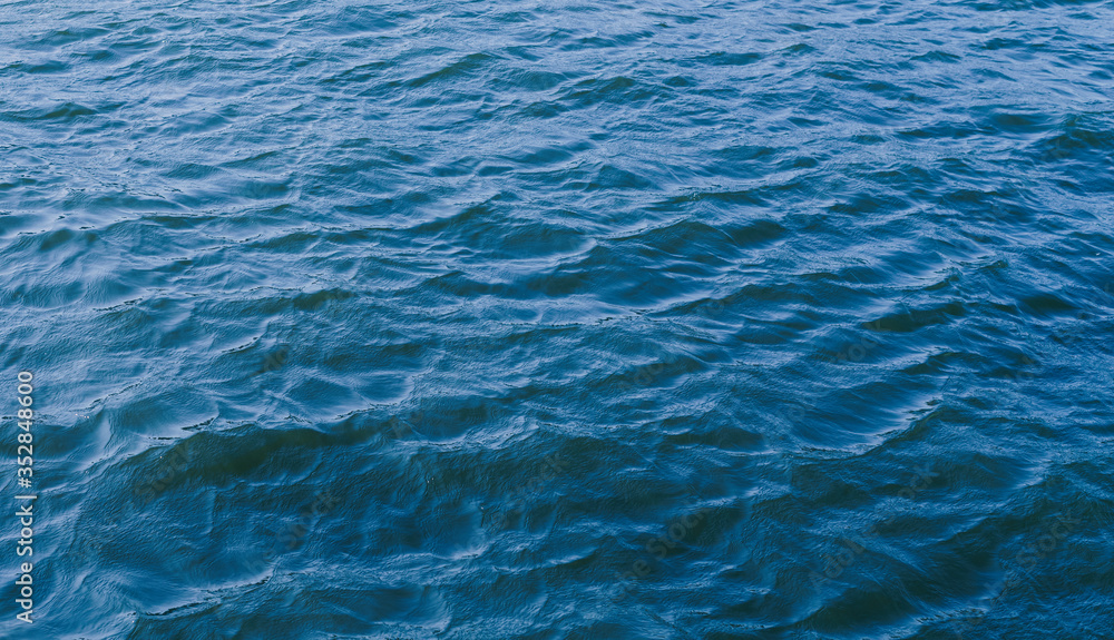 Blue sea surface for background. Selective focus. Blue sea surface for background. Selective focus.