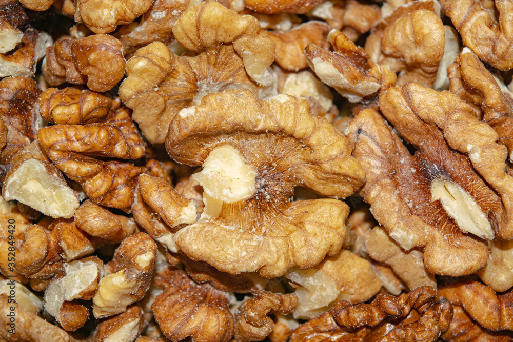 Peeled walnuts close-up. Surface texture. Healthy diet. Peeled walnuts close-up. Surface texture. Healthy diet.