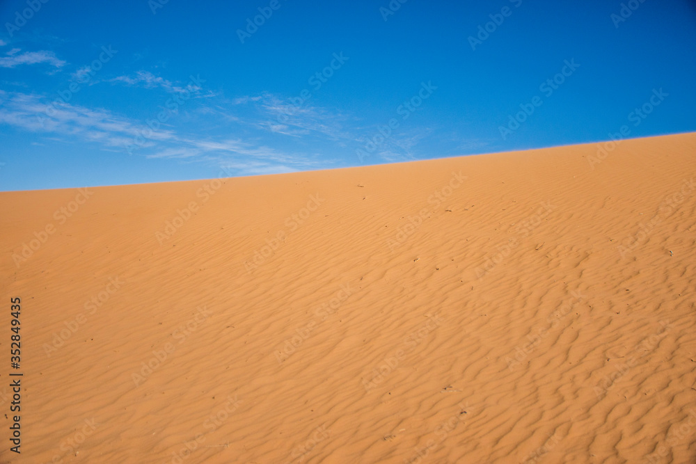 Ripple sand dunes and blue sky background, Perry Sandhills, Australia Ripple sand dunes and blue sky background, Perry Sandhills, Australia