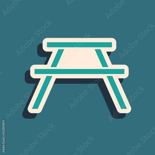 Green Picnic table with benches on either side of the table icon isolated on green background. Long shadow style. Vector Illustration