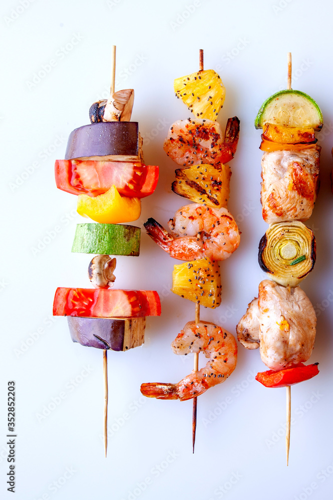 seafood meat bacon grilled vegetables on wooden skewers