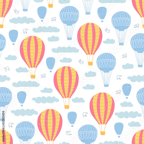 Children's seamless pattern with air balloons, rainbow, clouds and birds on white background. Cute texture for kids room design, Wallpaper, textiles, wrapping paper, apparel. Vector illustration