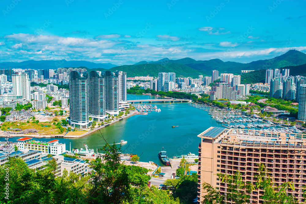 Sanya city, Hainan island. Aerial view of the city center from Luhuitou Park. Excellent tourism destination for summer vacation by the sea. Sanya is the southernmost city in China. Paradise island.