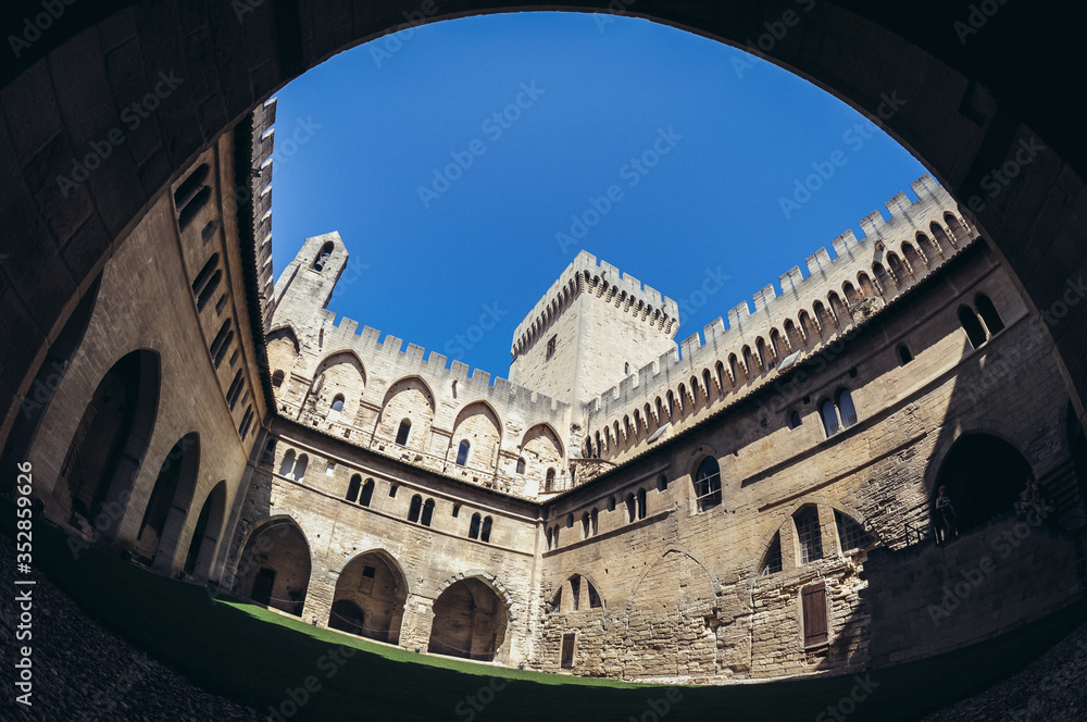 Courtyard of Palace of the Popes historical palace located in Avignon, Southern France