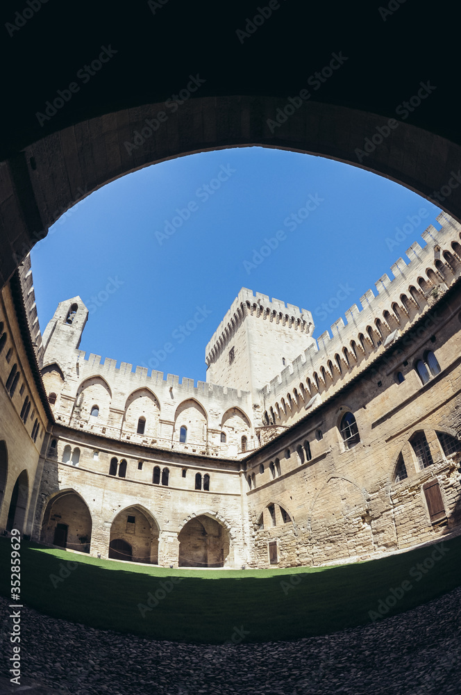 Courtyard of Palace of the Popes historical palace located in Avignon, Southern France