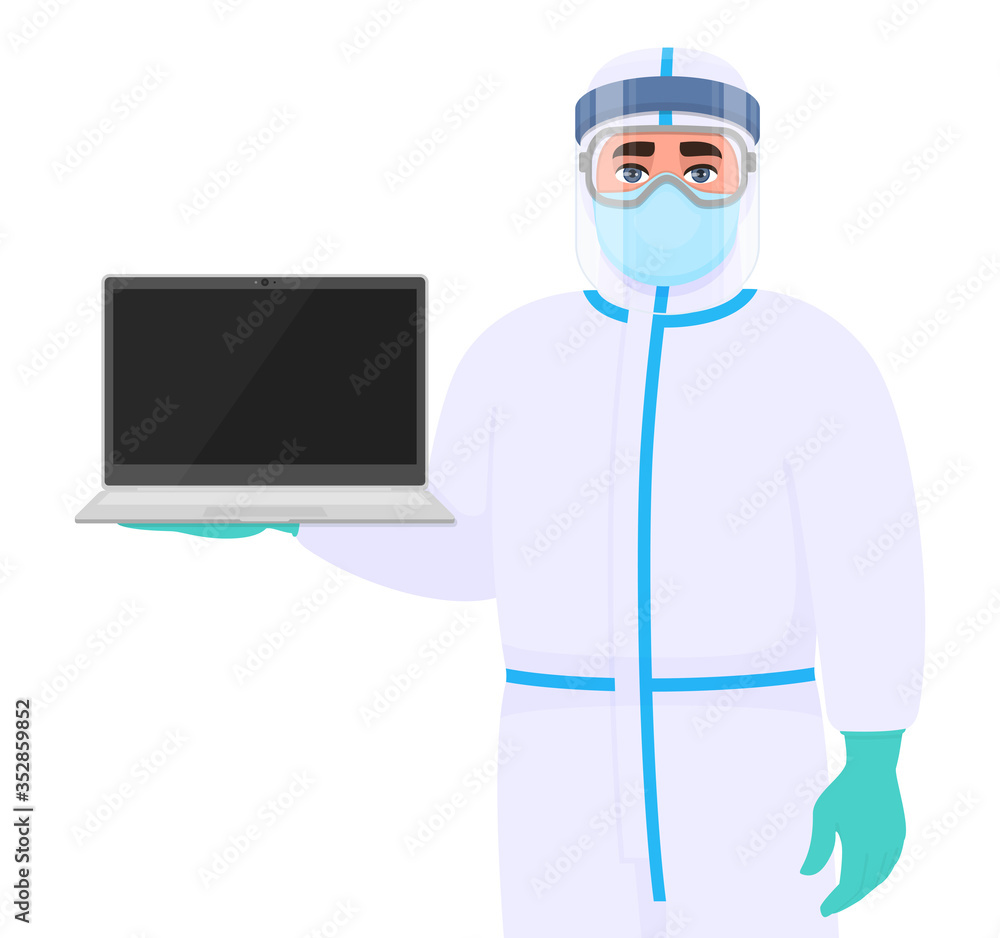 Doctor in safety protection suit uniform, mask, glasses and face shield showing laptop computer. Physician or surgeon holding PC notebook. Person wearing personal protective equipment dress (PPE).