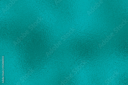 Turquoise metallic effect. Texture shine foil. Background with glitterer metal effect. Blue green surface. Backdrop glitter mint metal plate. Metallic texture foil for design invitation, cards, prints