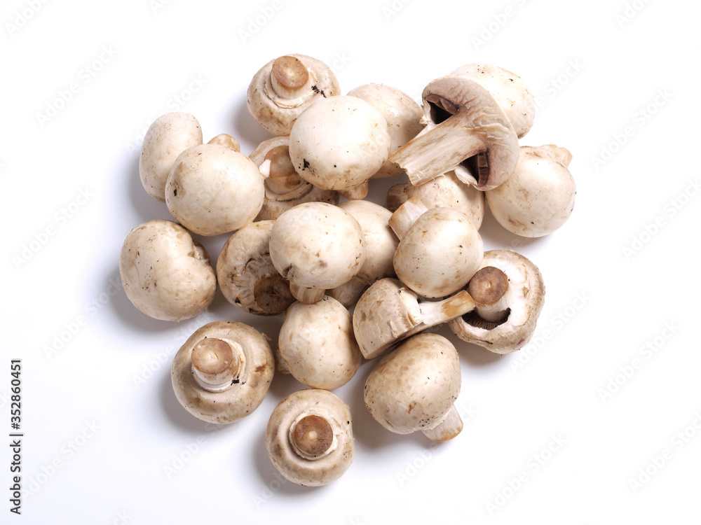Fresh white champignons on the kitchen table. Ingredients for cooking
