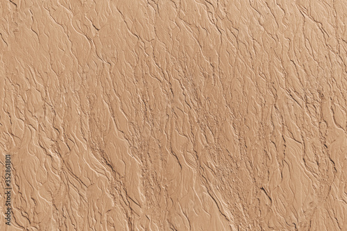 Tableau sur toile Patterns texture of sand left in the beach by receding tidal waters at the sea s