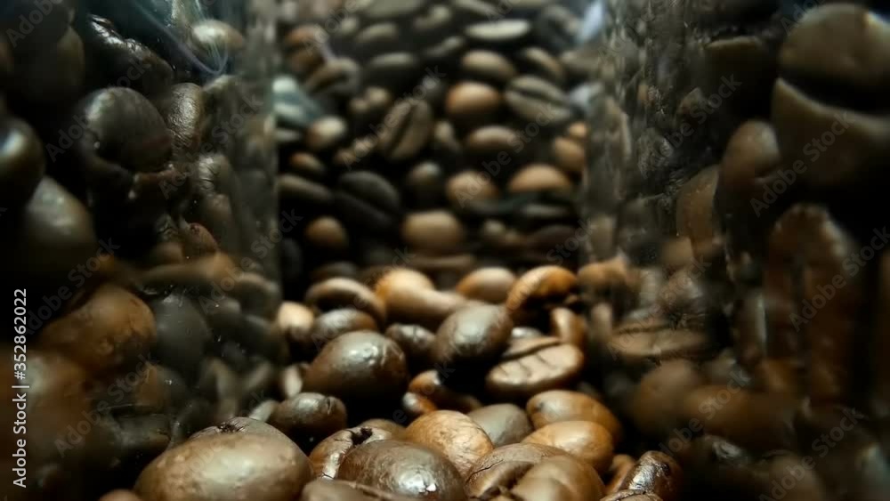 The camera moves slowly between transparent packages of coffee bean, on a store shelf and ready to make coffee. Macro. Closeup. Shallow depth of field. Ultra small special camera The camera moves slowly between transparent packages of coffee bean, on a store shelf and ready to make coffee. Macro. Closeup. Shallow depth of field. Ultra small special camera