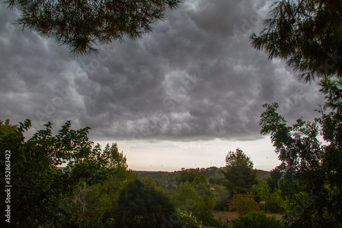 A storm begins to form on the outskirts of Valencia